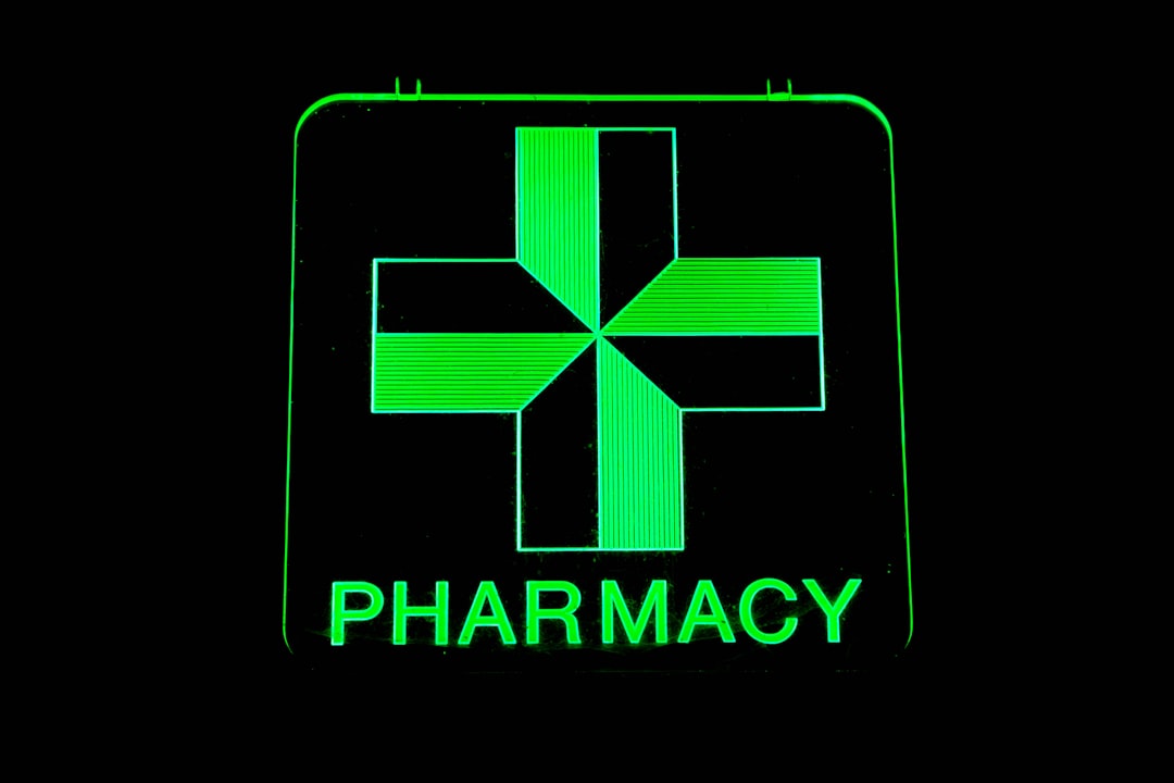 Home a-green-pharmacy-sign-with-a-cross-on-it-mr0lrkp5myw
